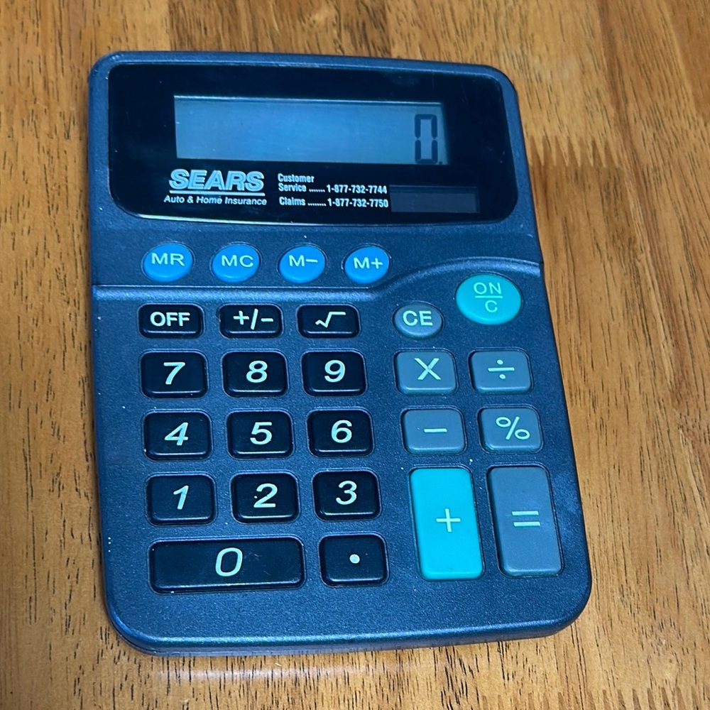 Vintage solar calculator. Sears advertisement for auto & home insurance. Works